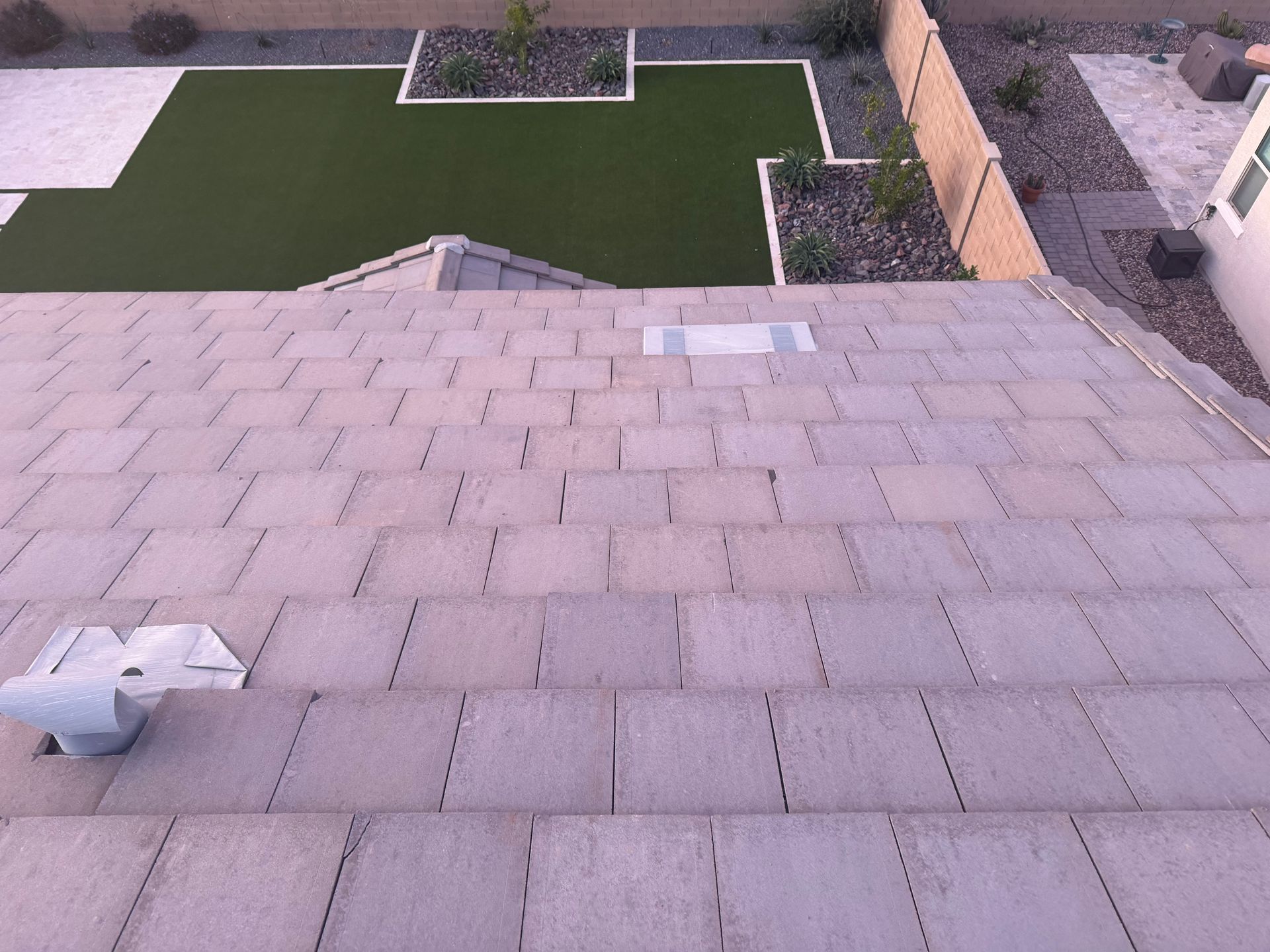 Day 1 Roofing technician repairing damaged shingles in Phoenix, AZ