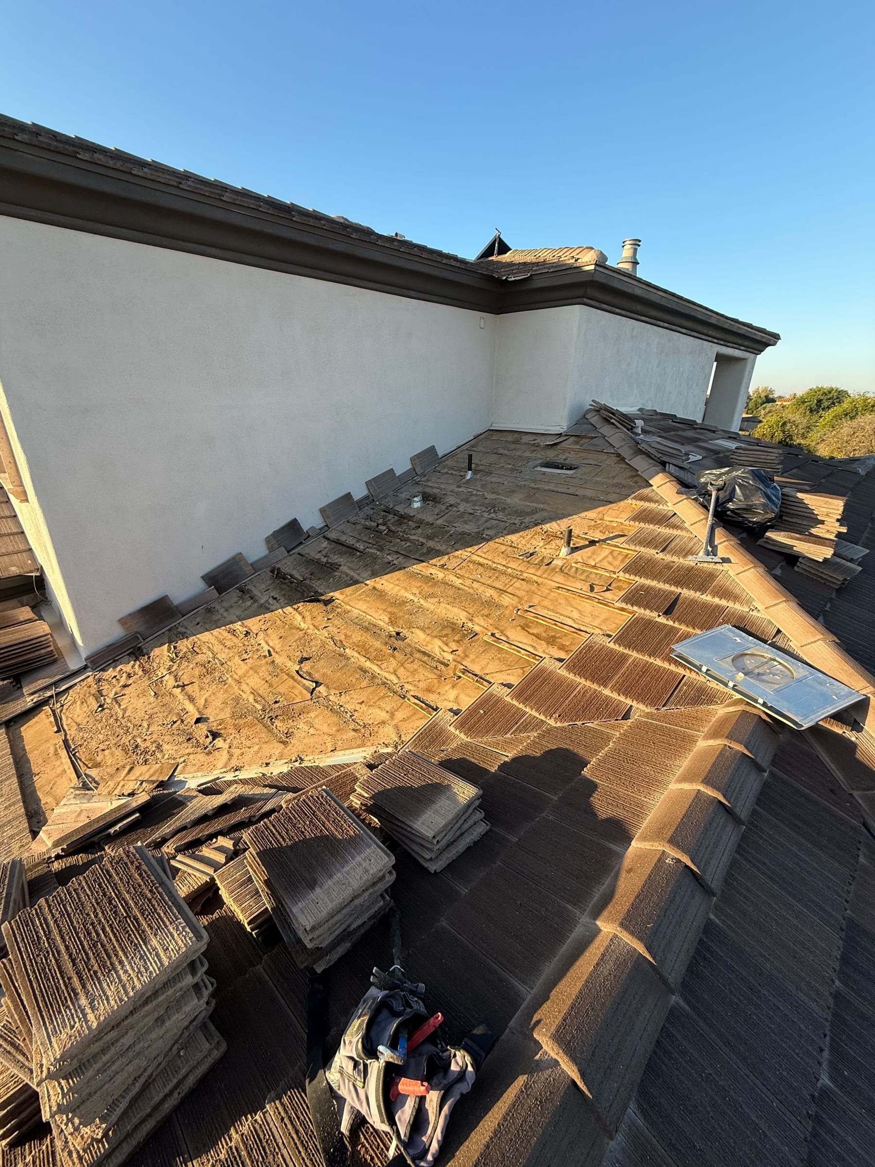 Day 1 Roofing roofers working on a home in Phoenix, AZ