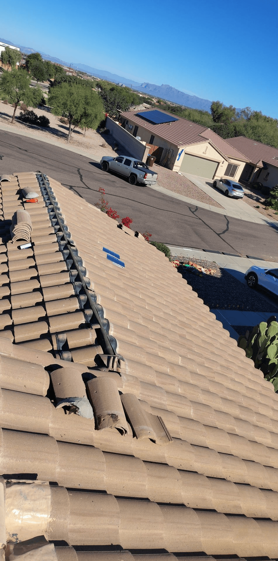 Roofer servicing a tile roof in the Phoenix, AZ service area